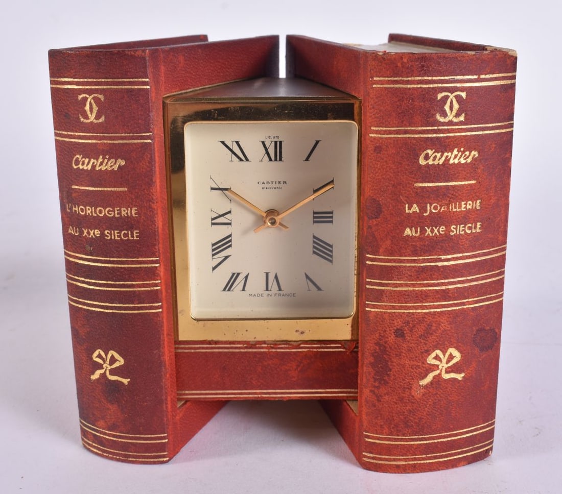 A CARTIER BOOK CLOCK. Clock 6 cm x 4.5 cm. (1 of 6)