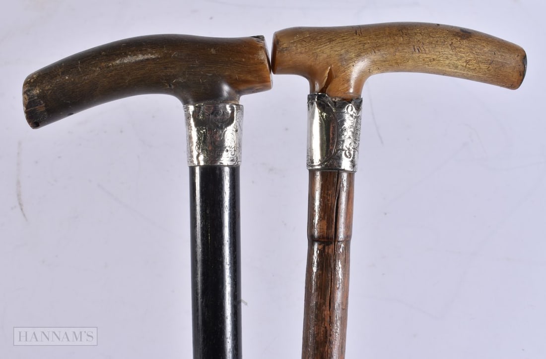TWO ANTIQUE CARVED HORN HANDLED WALKING CANES with silver mounts. 90 cm long. (2) (1 of 5)