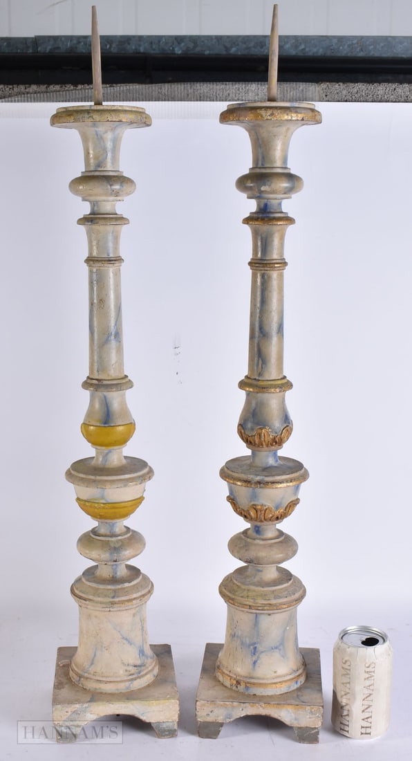 A LARGE PAIR OF ANTIQUE CONTINENTAL PAINTED PRICKET WOOD CANDLESTICKS. 80 cm high.: A LARGE PAIR OF ANTIQUE CONTINENTAL PAINTED PRICKET WOOD CANDLESTICKS. 80 cm high.