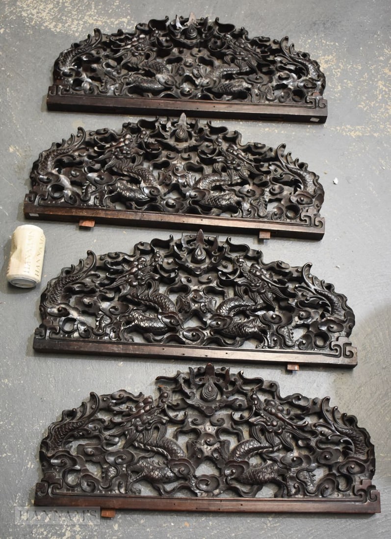A SET OF FOUR 19TH CENTURY CHINESE CARVED HARDWOOD DRAGON PANELS possibly Zitan, Ex Lempertz, Qing. (1 of 12)