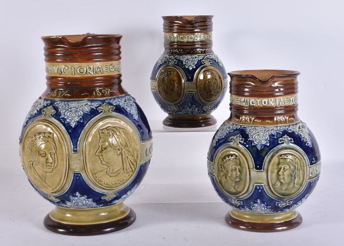 A SET OF THREE DOULTON LAMBETH STONEWARE CORONATION JUGS. Largest 23 cm x 15 cm. (3) (1 of 4)