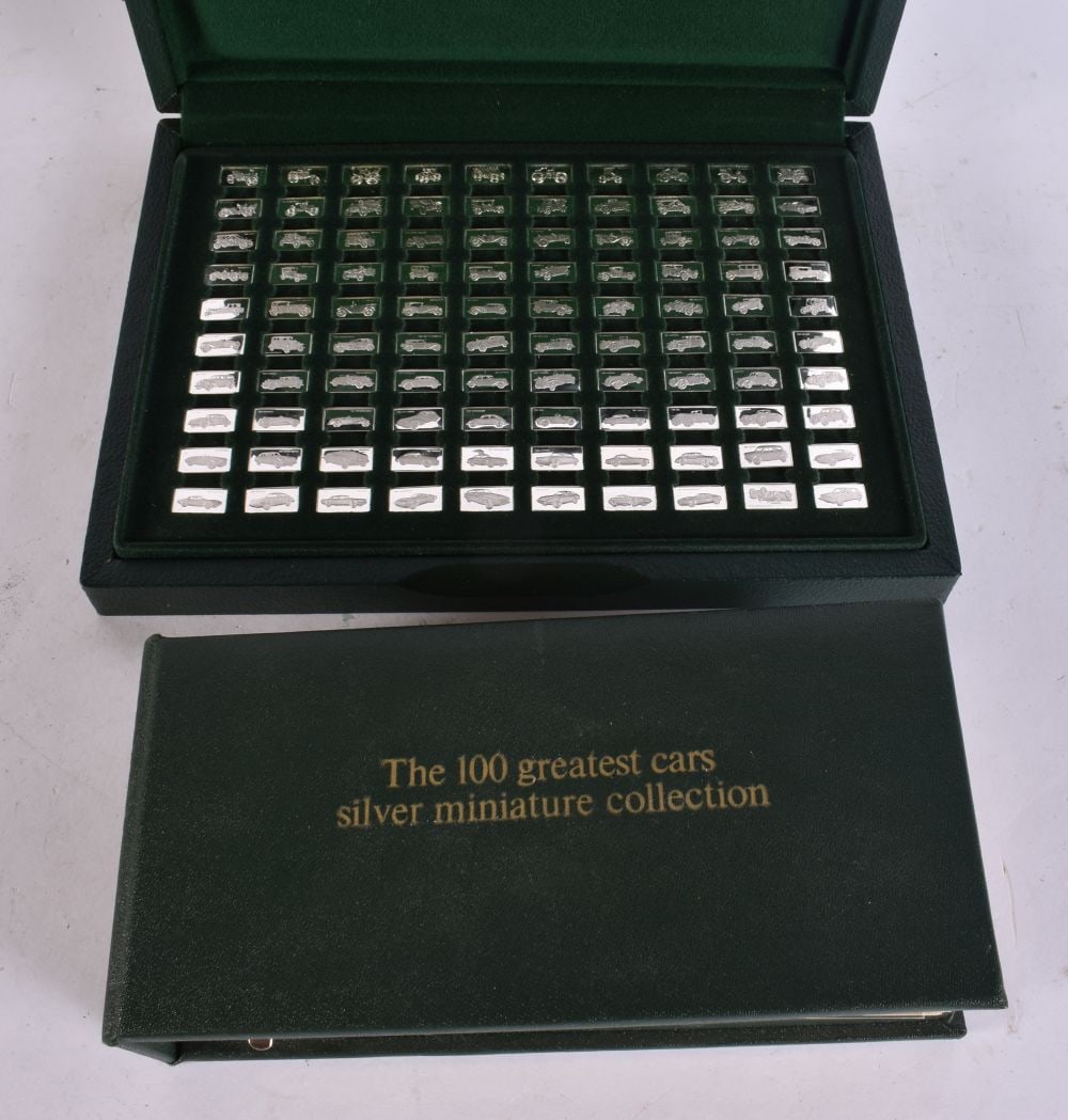 A CASED SET OF SILVER MINIATURE CAR PLAQUES. (qty): A CASED SET OF SILVER MINIATURE CAR PLAQUES. (qty)