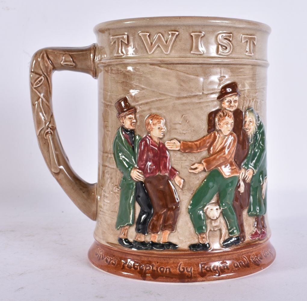 A ROYAL DOULTON OLIVER TWIST TANKARD. 15 cm x 15 cm. (1 of 5)