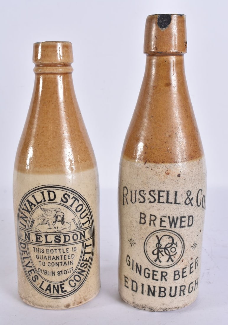 TWO STONEWARE BEER BOTTLES. 22 cm high. (2) (1 of 6)