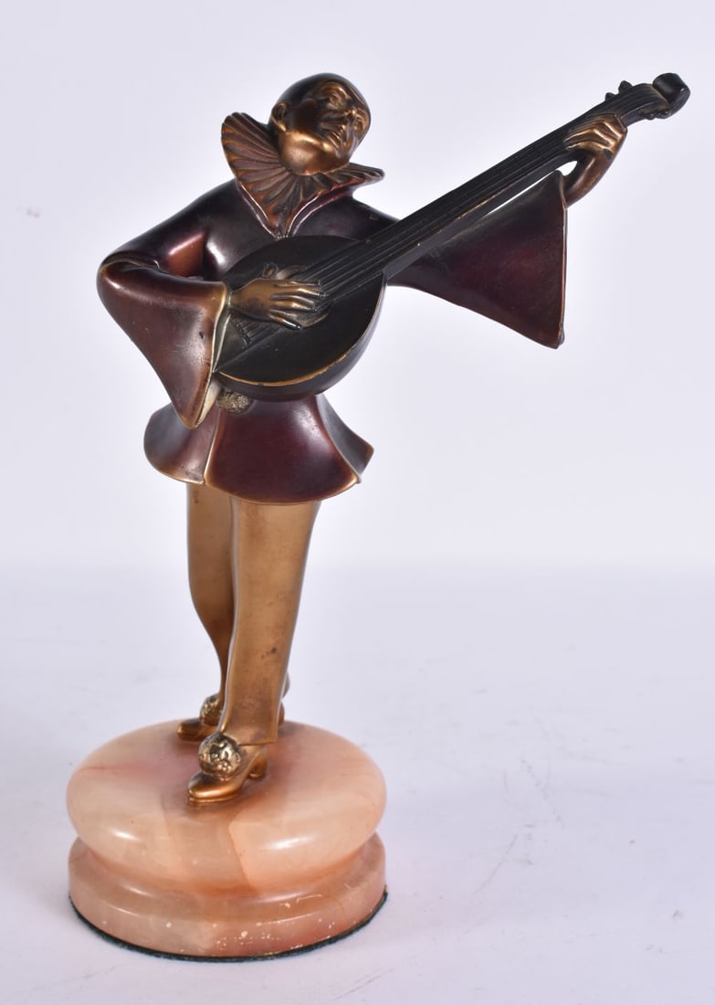 AN ART DECO COLD PAINTED MUSICIAN. 25 cm high.: AN ART DECO COLD PAINTED MUSICIAN. 25 cm high.