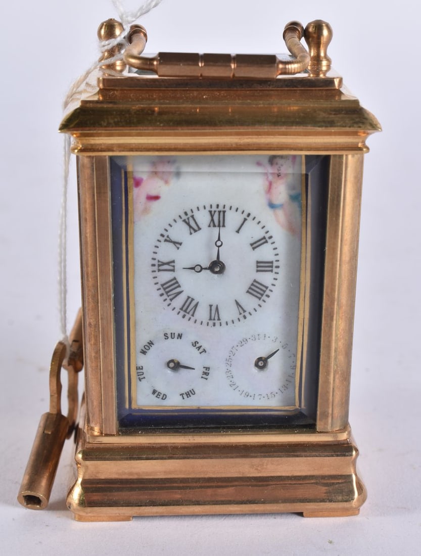 A MINIATURE PORCELAIN INSET CARRIAGE CLOCK. Running. 10 cm high inc handle. (1 of 7)