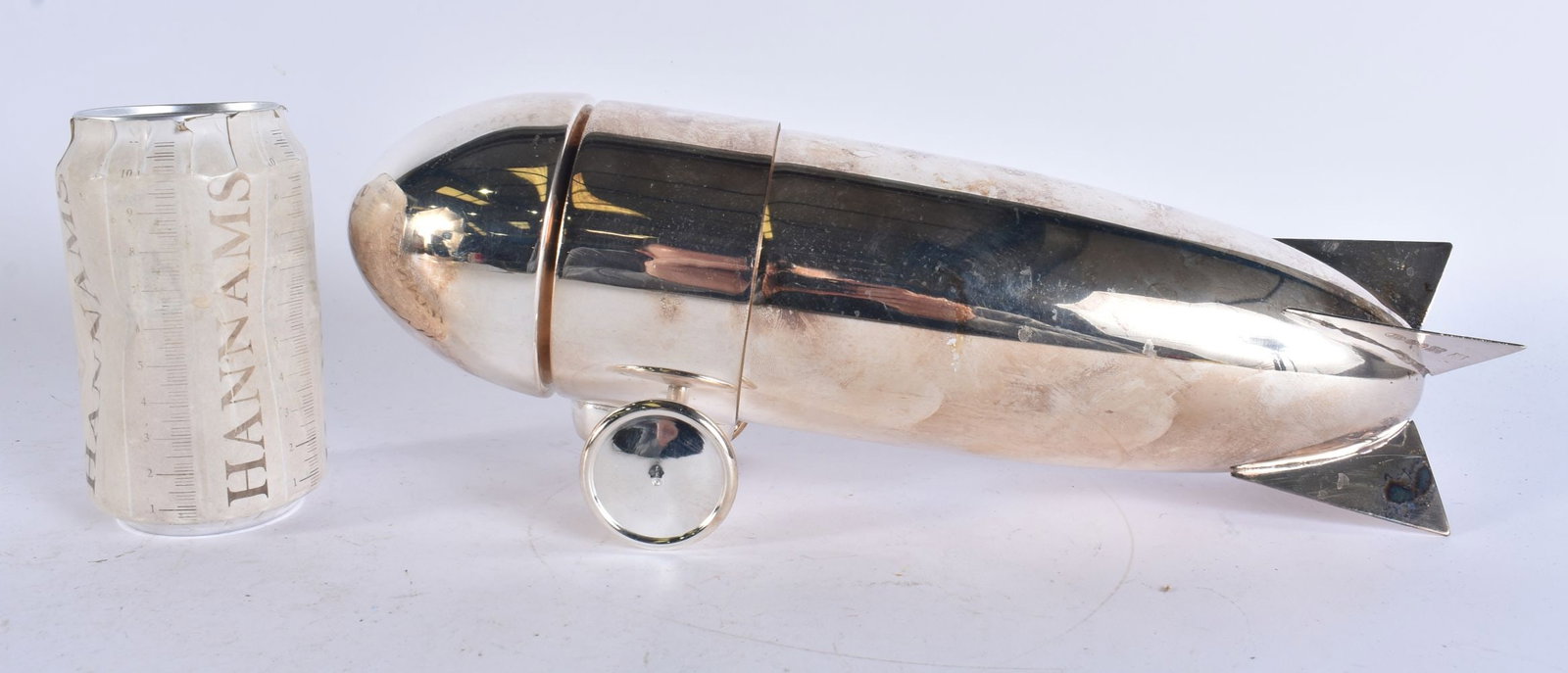A SILVER PLATED ZEPPELIN COCKTAIL SHAKER. 29 cm wide. (1 of 5)