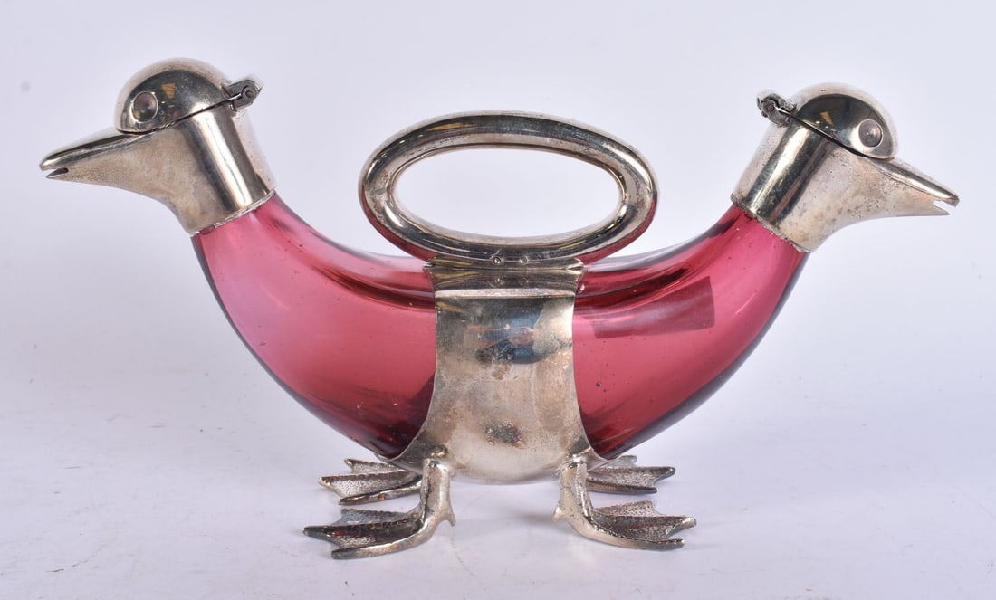 A SILVER PLATED DOUBLE DUCK DECANTER. 22.5 cm wide.: A SILVER PLATED DOUBLE DUCK DECANTER. 22.5 cm wide.