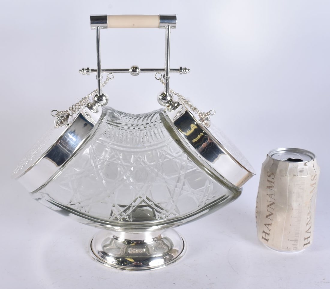 A LARGE SILVER PLATED GLASS BISCUIT BARREL. 28 cm x 18 cm. (1 of 5)
