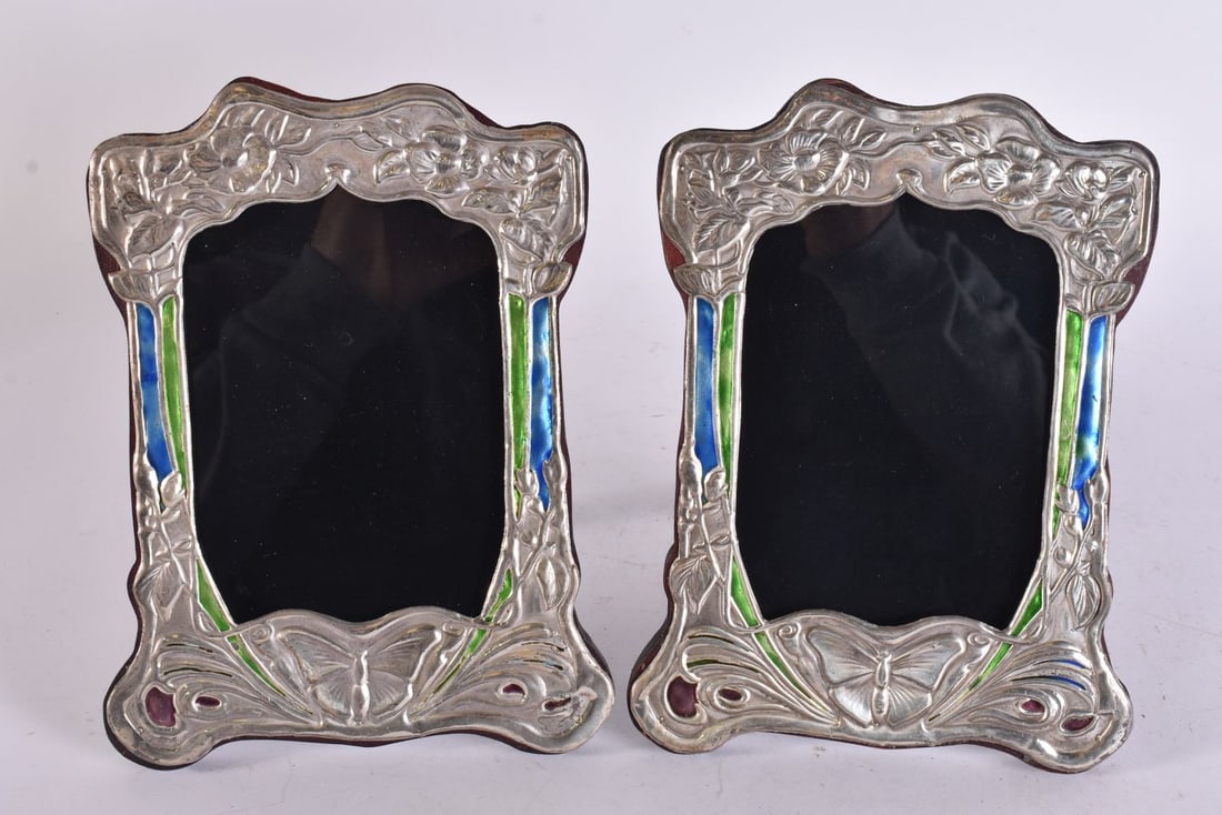 A PAIR OF SILVER AND ENAMEL PHOTOGRAPH FRAMES. 520 grams overall. 21 cm x 15 cm. (1 of 4)