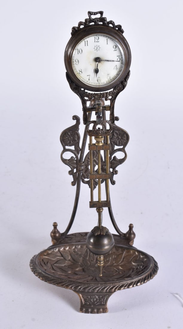 A CONTINENTAL BRONZE SWINGING CLOCK. 26 cm high. (1 of 4)