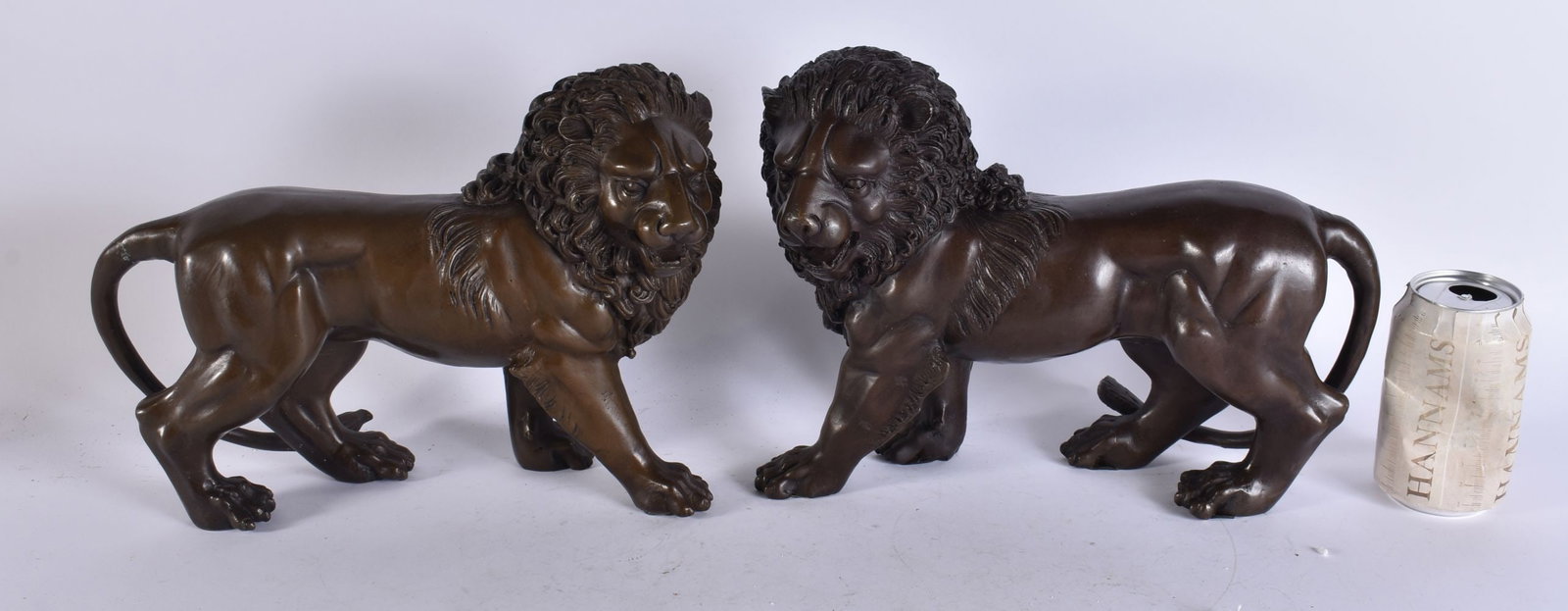 A PAIR OF CONTINENTAL BRONZE LIONS. 28 cm x 22 cm. (1 of 6)