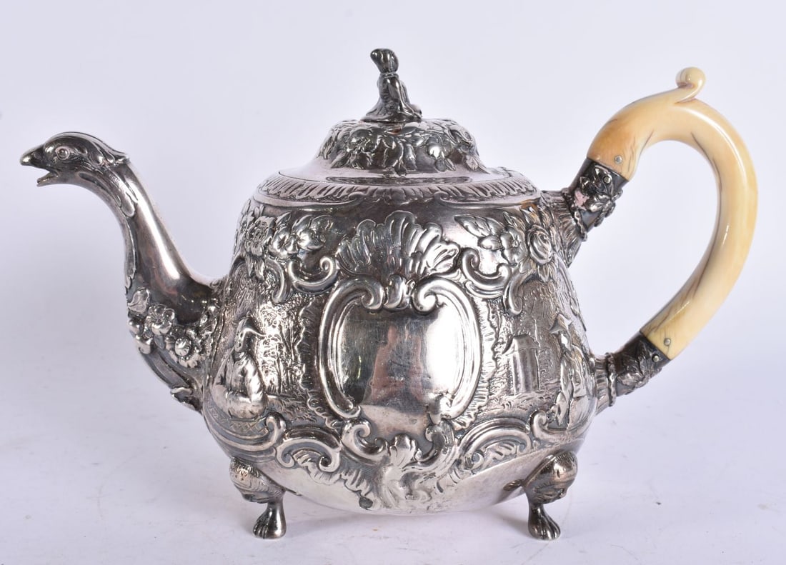 AN UNUSUAL GEORGE III SILVER CHINOISERIE TEAPOT with replacement resin handle. 678 grams. 23.5 cm wi (1 of 5)