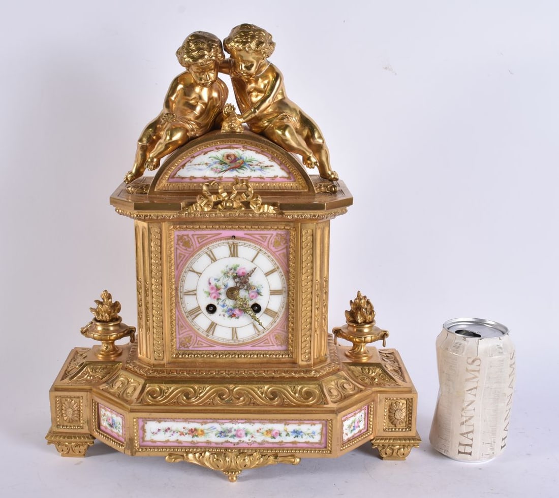 A 19TH CENTURY FRENCH PORCELAIN GILT BRONZE MANTEL CLOCK. 36 cm x 26 cm.: A 19TH CENTURY FRENCH PORCELAIN GILT BRONZE MANTEL CLOCK. 36 cm x 26 cm.