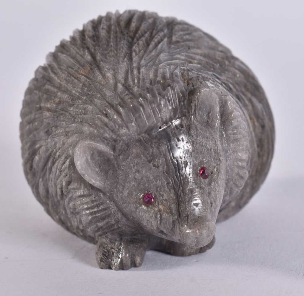 A CONTINENTAL RUBY EYED STONE HEDGEHOG. 7 cm x 5.5 cm. (1 of 5)