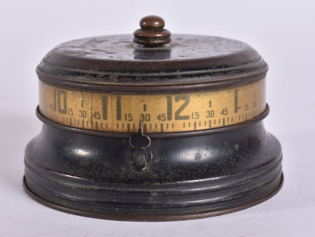 A VINTAGE TABLE CLOCK. Running. 7.25 cm wide. (1 of 4)
