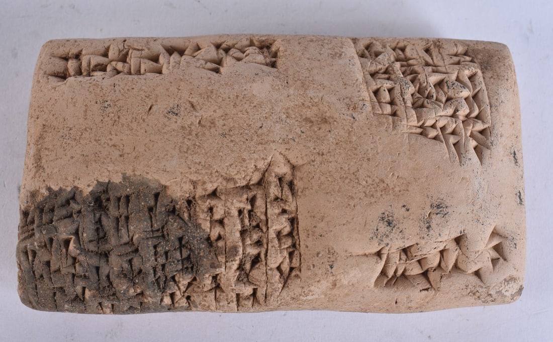 AN ANTIQUITY CUNEIFORM TABLET. 11.5 cm x 7.5 cm. (1 of 5)