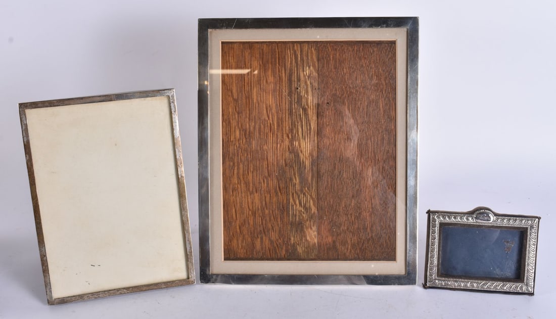 THREE SILVER PHOTOGRAPH FRAMES. 1110 grams overall. Largest 28 cm x 24 cm. (3) (1 of 7)