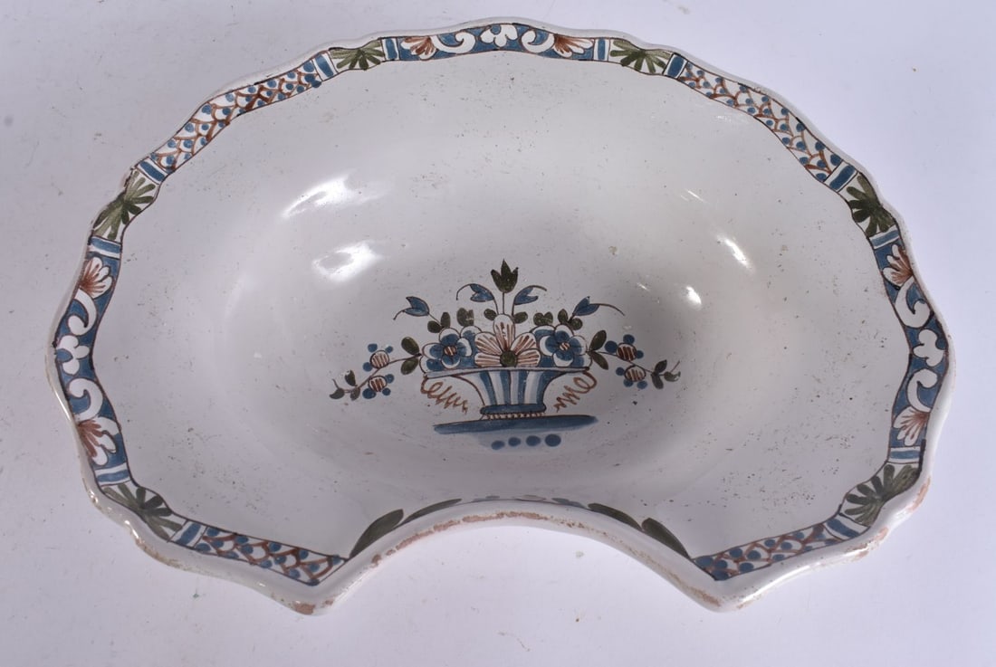 AN ANTIQUE FAIENCE BARBERS BOWL. 28 cm x 22 c. (1 of 4)