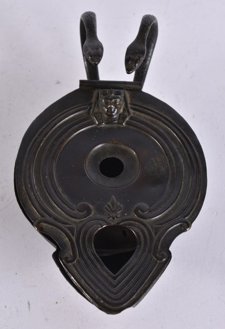 AN ANTIQUE OIL LAMP. 17 cm wide.: AN ANTIQUE OIL LAMP. 17 cm wide.