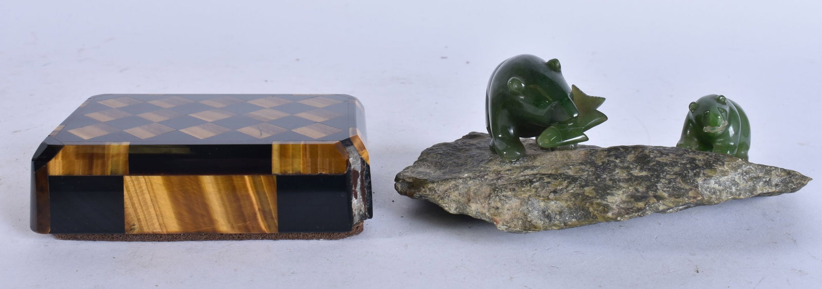 A STYLISH TIGERS EYE PAPERWEIGHT together with a jade sculpture of bears. (2) (1 of 6)