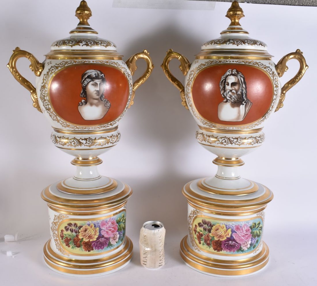 A FINE AND LARGE PAIR OF 19TH CENTURY FRENCH PORCELAIN TWIN HANDLED PEDESTAL VASES painted with flow: A FINE AND LARGE PAIR OF 19TH CENTURY FRENCH PORCELAIN TWIN HANDLED PEDESTAL VASES painted with flowers. 68 cm x 32 cm.