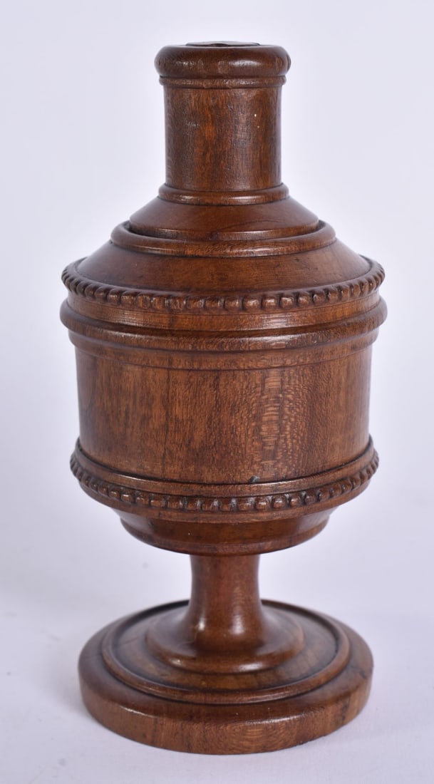 A TREEN CARVED WOOD SPICE SHAKER. 12 cm high. (1 of 4)