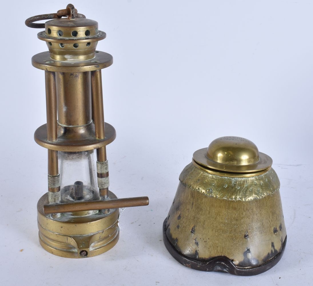 AN ANTIQUE MINERS LAMP and an inkwell. Largest 30 cm high. (2): AN ANTIQUE MINERS LAMP and an inkwell. Largest 30 cm high. (2)