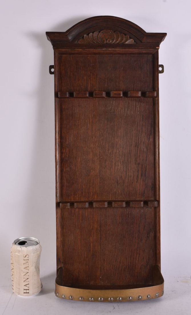 AN ART DECO CARVED WOOD PIPE RACK. 58 cm x 22 cm.: AN ART DECO CARVED WOOD PIPE RACK. 58 cm x 22 cm.
