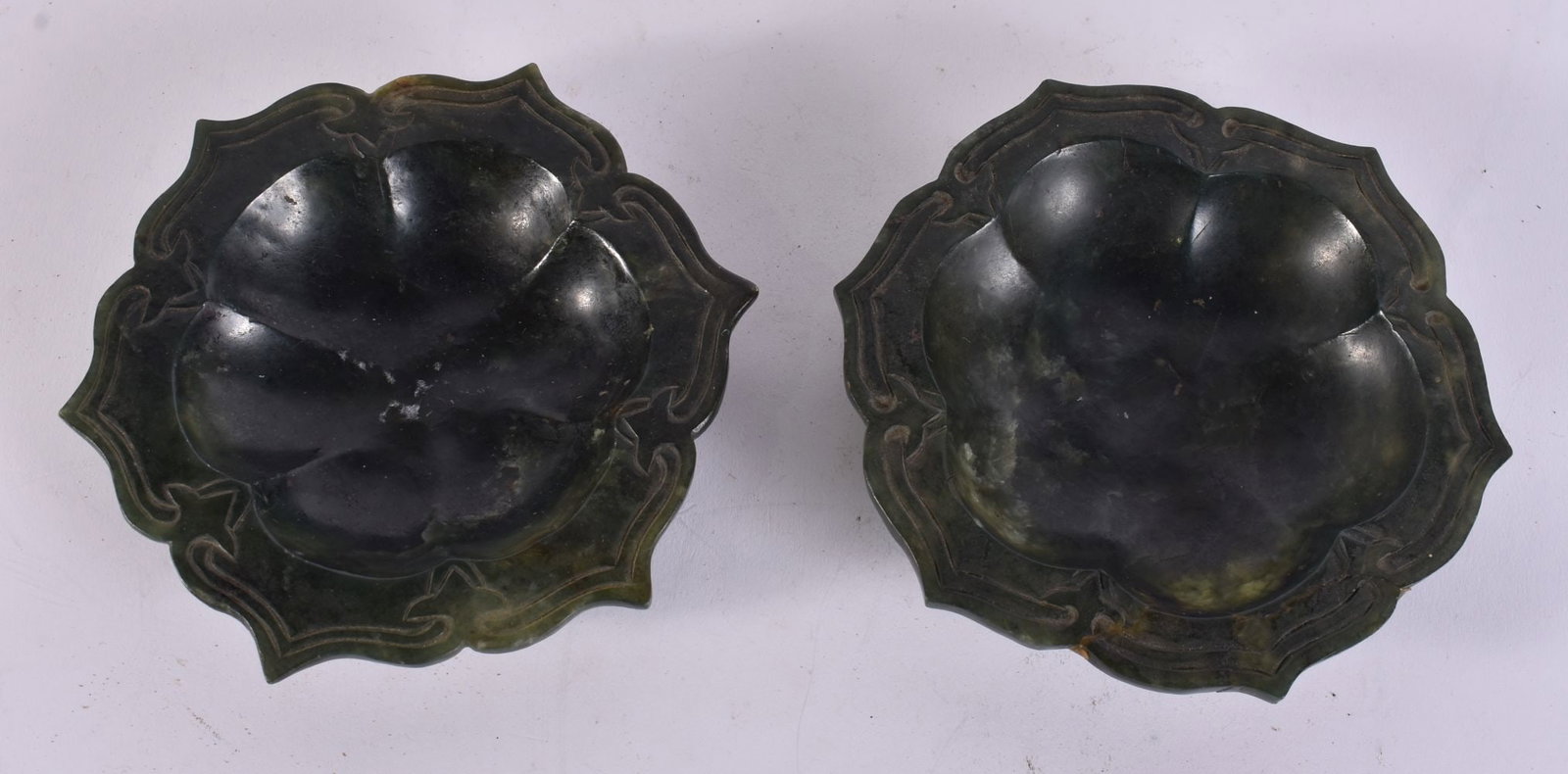 A PAIR OF CHINESE QING DYNASTY SPINACH JADE DISHES. 12 cm wide. (1 of 3)