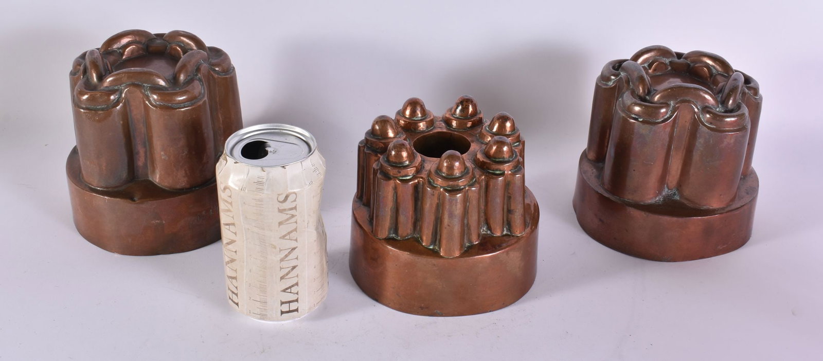 THREE VICTORIAN COPPER JELLY MOULDS. 12 cm wide. (3): THREE VICTORIAN COPPER JELLY MOULDS. 12 cm wide. (3)