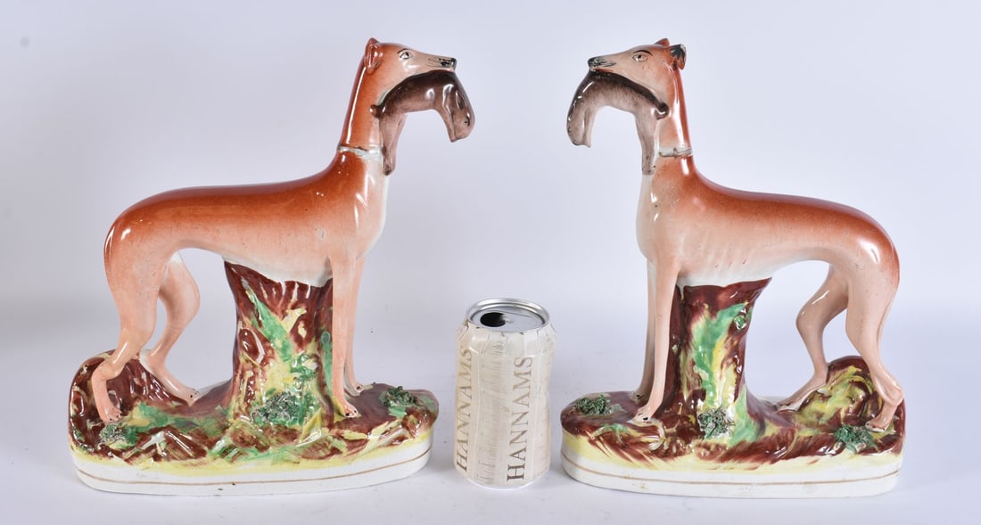 A PAIR OF VICTORIAN STAFFORDSHIRE GREYHOUNDS. 25 cm x 29 cm. (1 of 4)