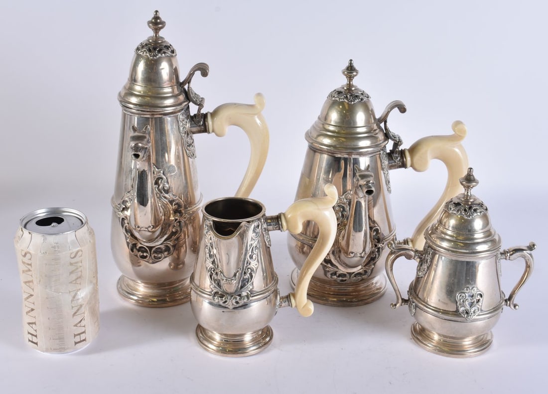 AN ANTIQUE SILVER FOUR PIECE COFFEE SET with replacement resin handles. 2230 grams. Largest 28 cm hi (1 of 2)