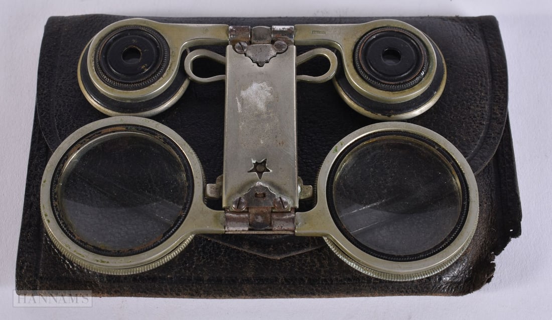 A PAIR OF LEATHER CASED LORGNETTES. 12 cm x 8 cm. (1 of 2)