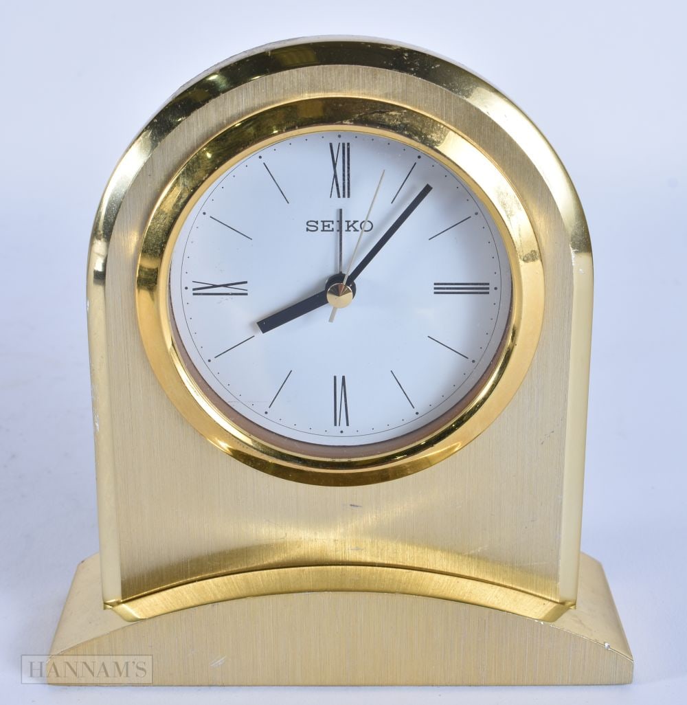 A SEIKO CLOCK. Working. 13.5 cm x 9.5 cm. (1 of 3)