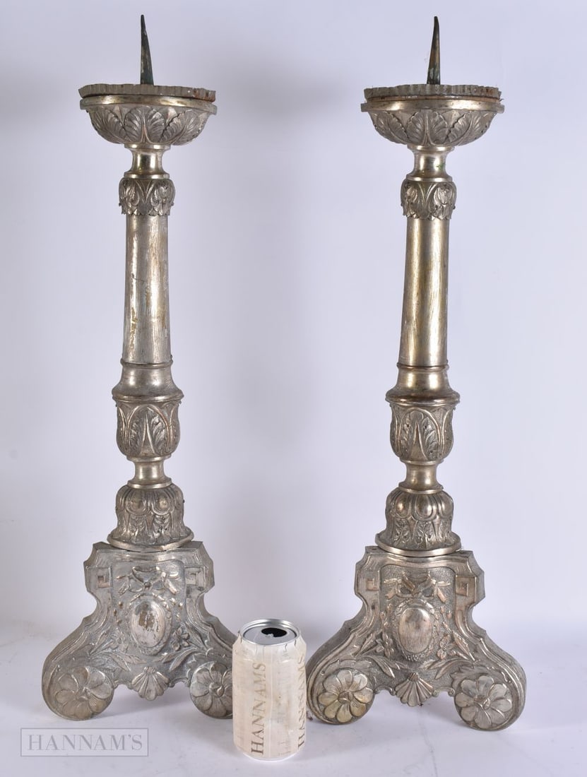 A PAIR OF ANTIQUE CONTINENTAL PRICKET CANDLESTICKS. 60 cm high. (1 of 2)