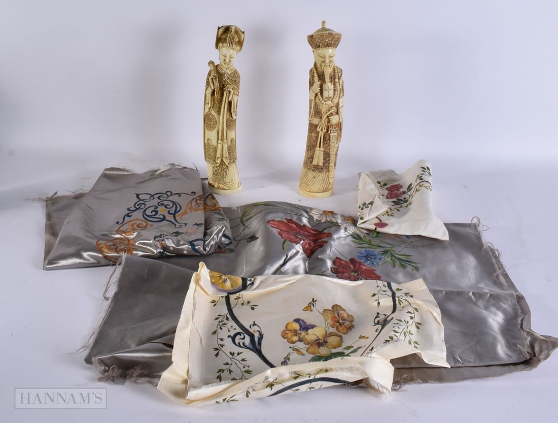 A PAIR OF CHINESE RESIN IMMORTALS together with silks. (qty) (1 of 4)