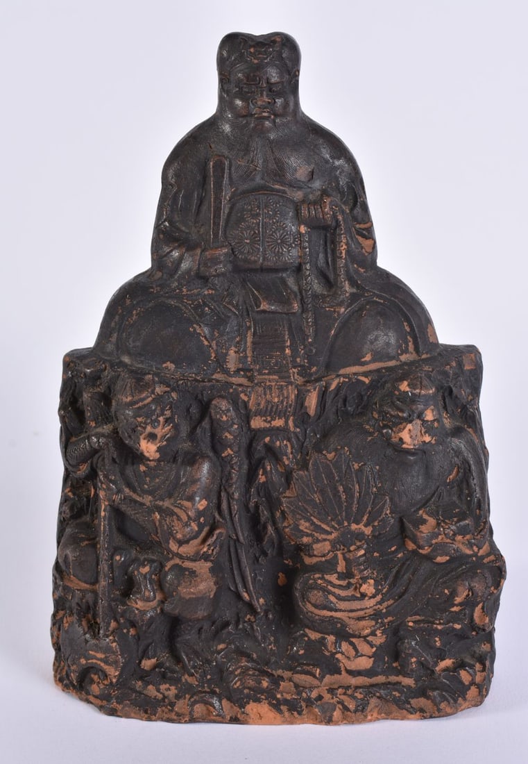 A LATE 19TH/20TH CENTURY SOUTH EAST ASIAN TERRACOTTA FIGURE modelled as a male with attendants. 18 c (1 of 8)