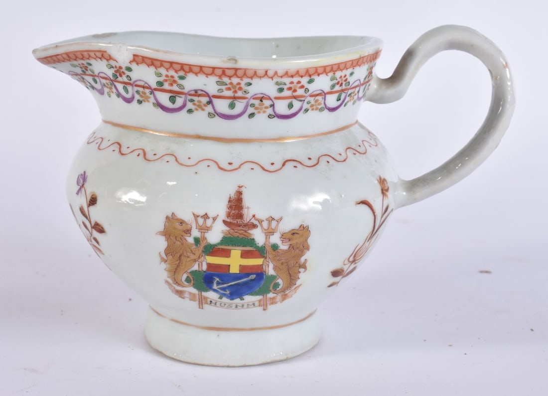 A CHINESE QING DYNASTY FAMILLE ROSE ARMORIAL CREAM JUG. 14 cm wide. (1 of 6)