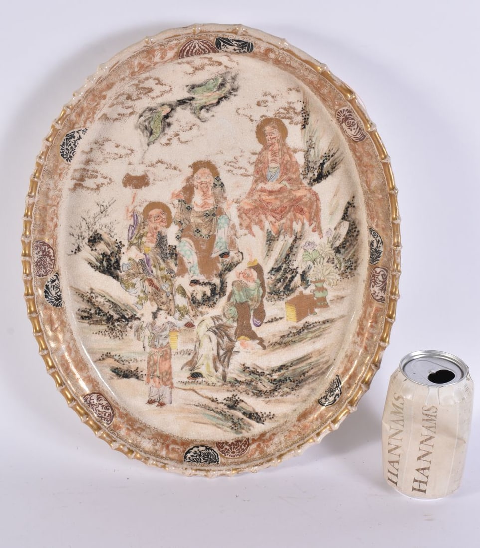A LARGE 19TH CENTURY JAPANESE MEIJI PERIOD SATSUMA DISH painted with immortals. 38 cm x 22 cm.: A LARGE 19TH CENTURY JAPANESE MEIJI PERIOD SATSUMA DISH painted with immortals. 38 cm x 22 cm.