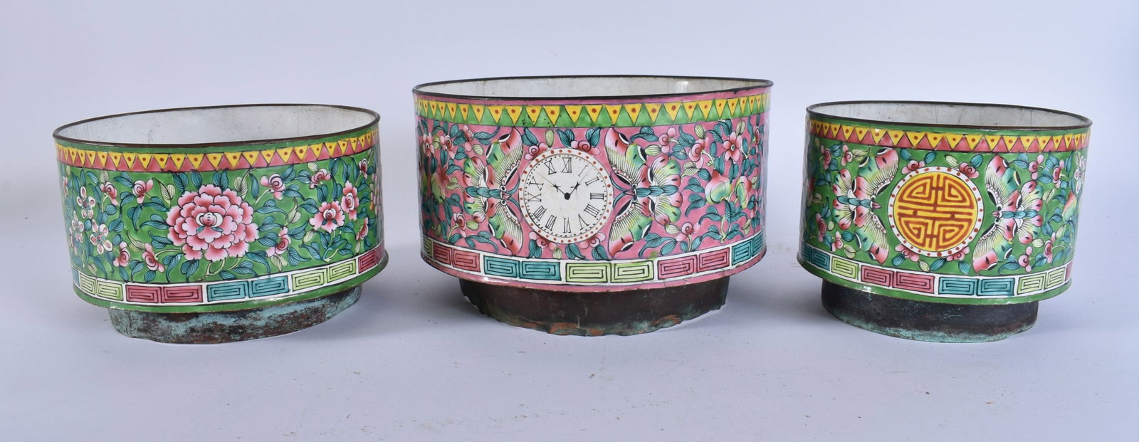 A RARE CHINESE QING DYNASTY CANTON ENAMEL SET OF RINGS unusually painted with a clock face. Largest (1 of 6)