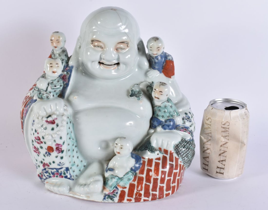A CHINESE REPUBLICAN PERIOD PORCELAIN FIGURE OF A BUDDHA modelled with attendants. 27 cm x 23 cm. (1 of 7)