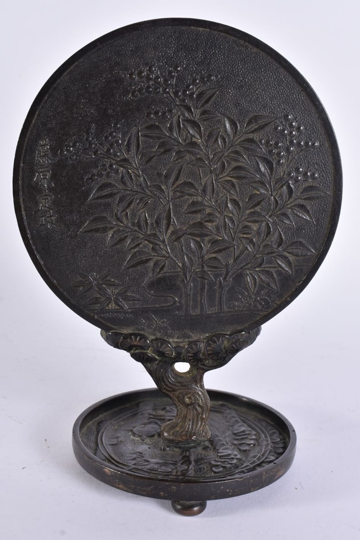 A 19TH CENTURY JAPANESE MEIJI PERIOD BRONZE PIPE STAND supported on an early bronze hand mirror. 20 (1 of 8)