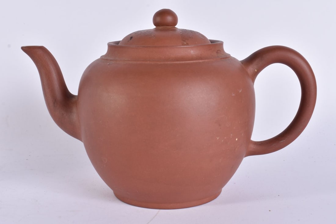 A LATE 19TH CENTURY CHINESE YIXING POTTERY TEAPOT AND COVER Late Qing. 18 cm wide.: A LATE 19TH CENTURY CHINESE YIXING POTTERY TEAPOT AND COVER Late Qing. 18 cm wide.