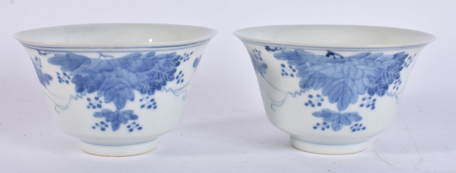 A PAIR OF 19TH CENTURY CHINESE BLUE AND WHITE PORCELAIN FLARED BOWLS painted with flowers. 11 cm wid (1 of 6)