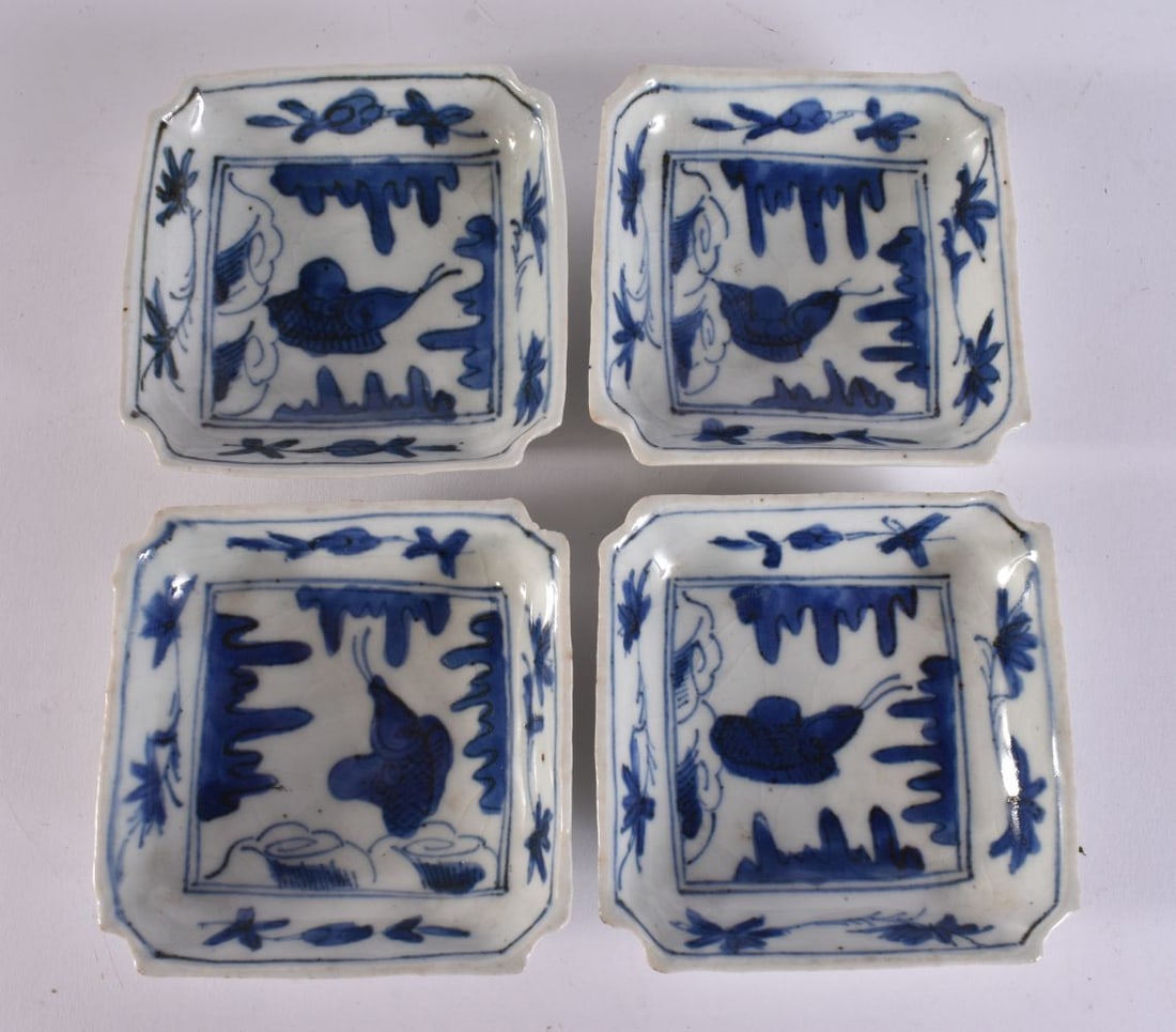 A SET OF FOUR 16TH/17TH CENTURY CHINESE BLUE AND WHITE DISHES Ming, painted with carp. 8.5 cm square (1 of 6)
