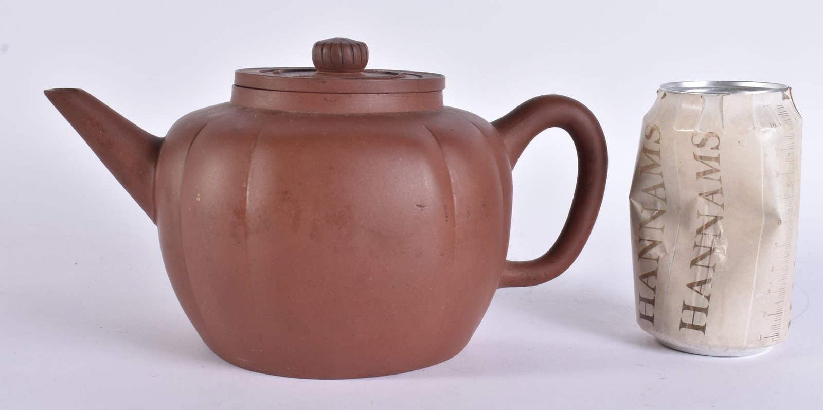 A LARGE LATE 19TH CENTURY CHINESE YIXING POTTERY TEAPOT AND COVER Late Qing. 21 cm wide.: A LARGE LATE 19TH CENTURY CHINESE YIXING POTTERY TEAPOT AND COVER Late Qing. 21 cm wide.