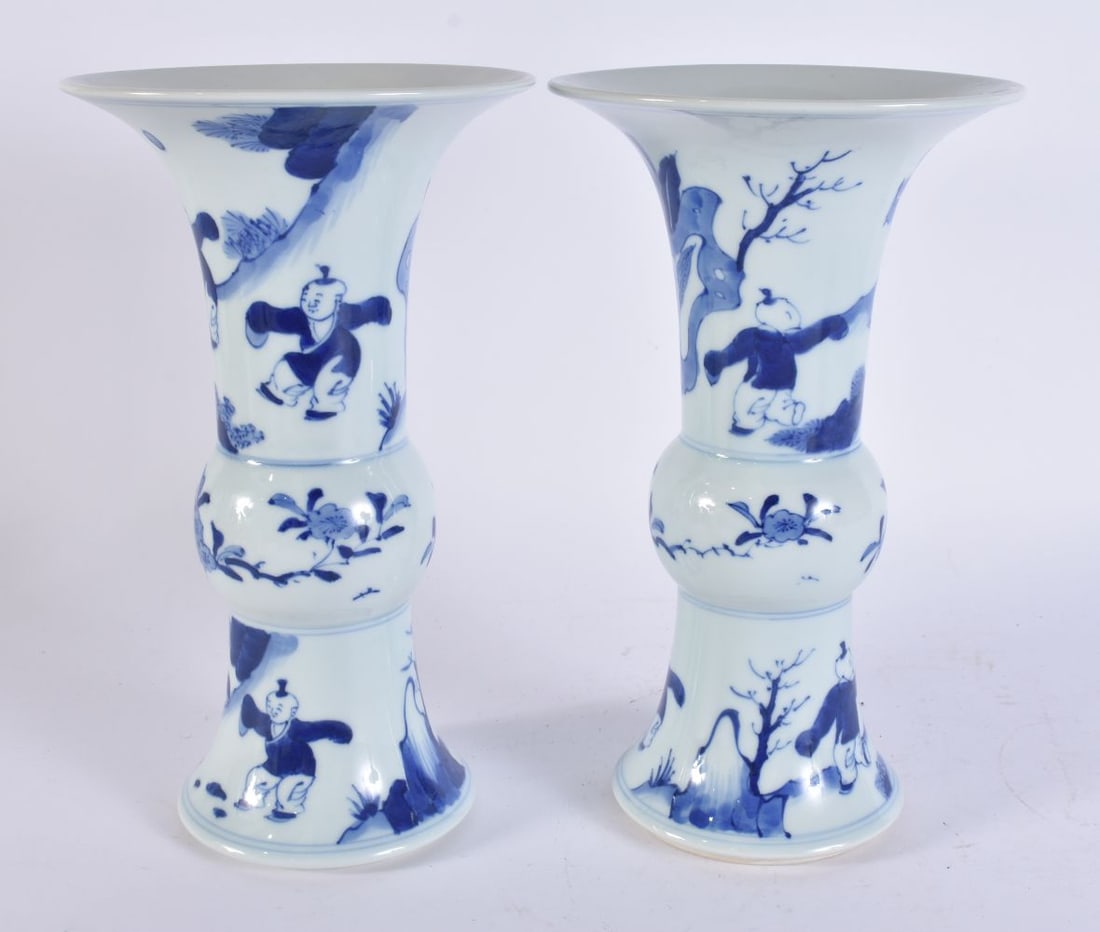 A PAIR OF CHINESE BLUE AND WHITE PORCELAIN GU FORM VASES. 25 cm high. (1 of 6)