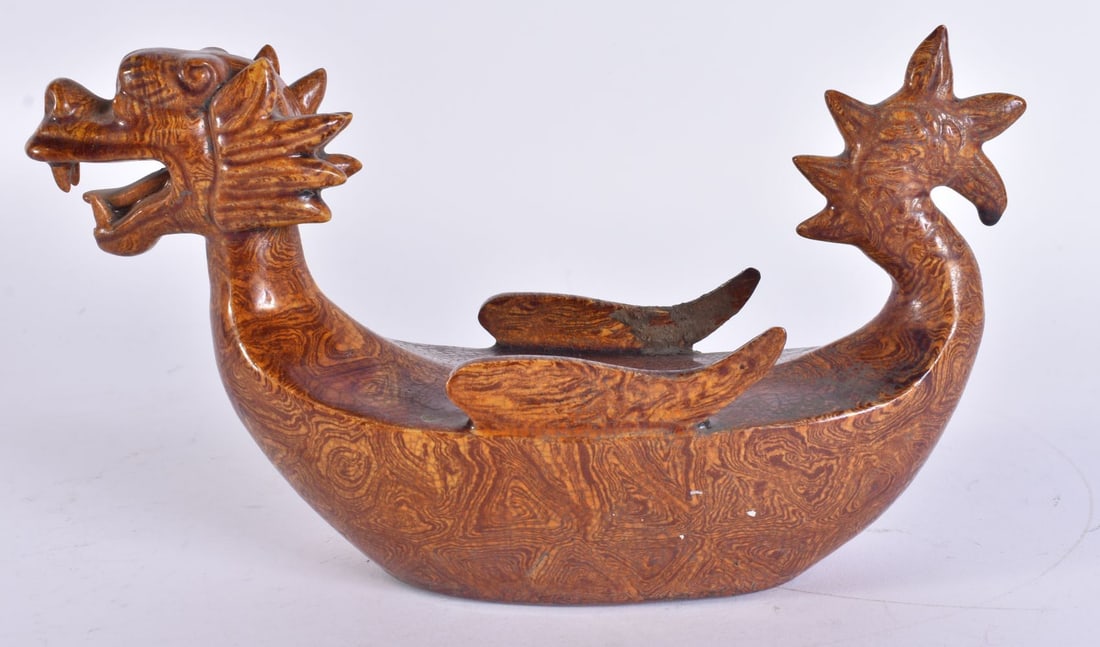 A CHINESE MARBLEISED POTTERY BOAT. 22 cm wide. (1 of 5)