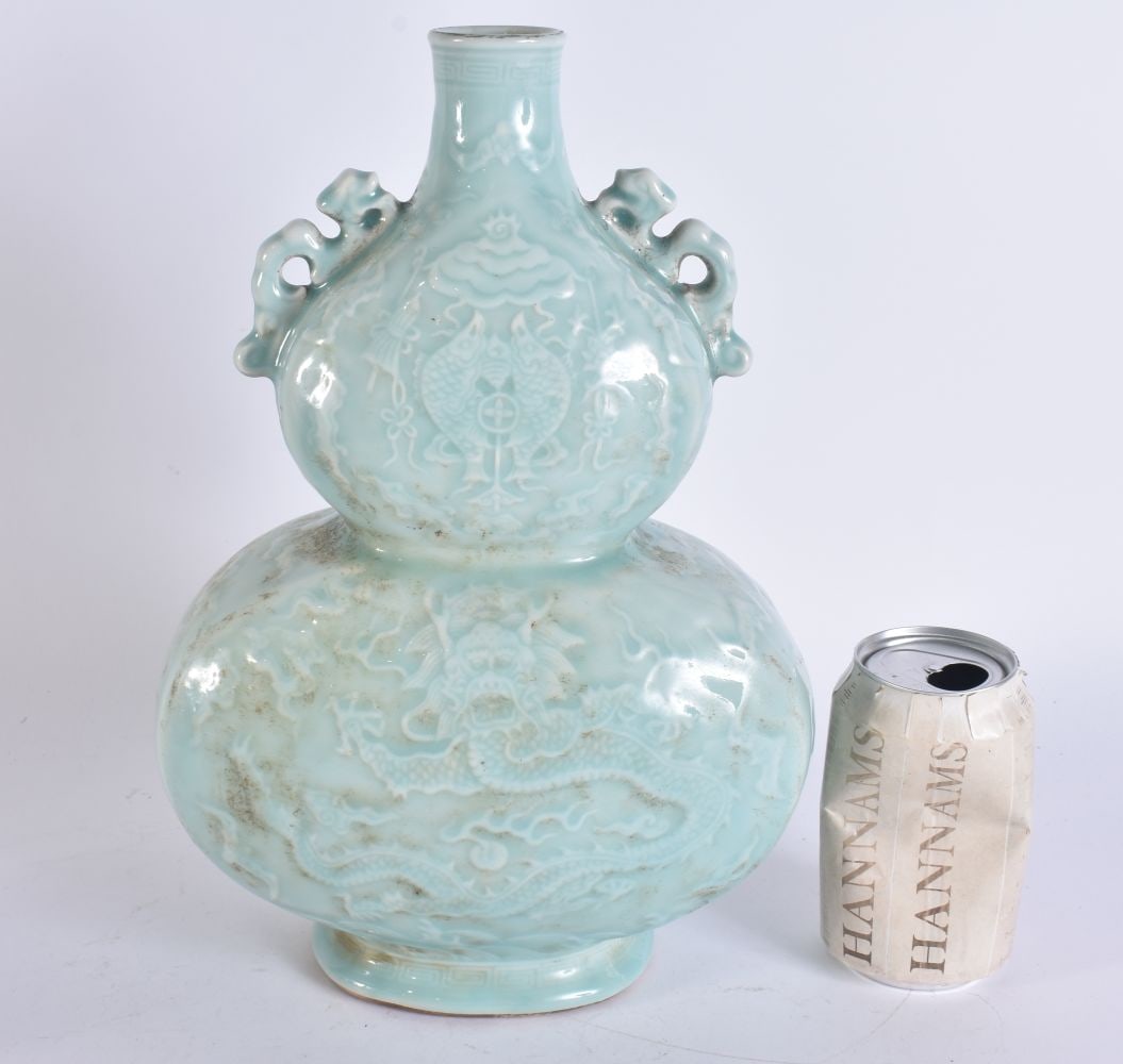 A CHINESE CELADON PORCELAIN VASE. 32 cm x 15 cm.: A CHINESE CELADON PORCELAIN VASE. 32 cm x 15 cm.